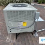 Rooftop package AC unit installed by HVAC Near Me, EnergyGuide efficiency label visible on the cabinet